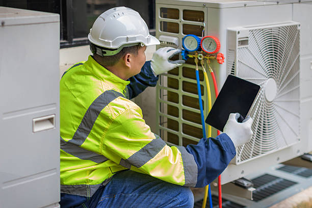 Professional Hvac technician working in Spanish Fort, AL